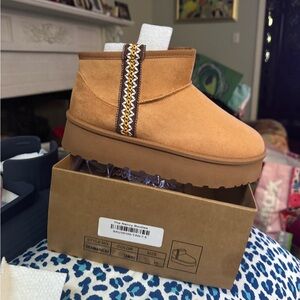 Tan brown platform sole short booties.